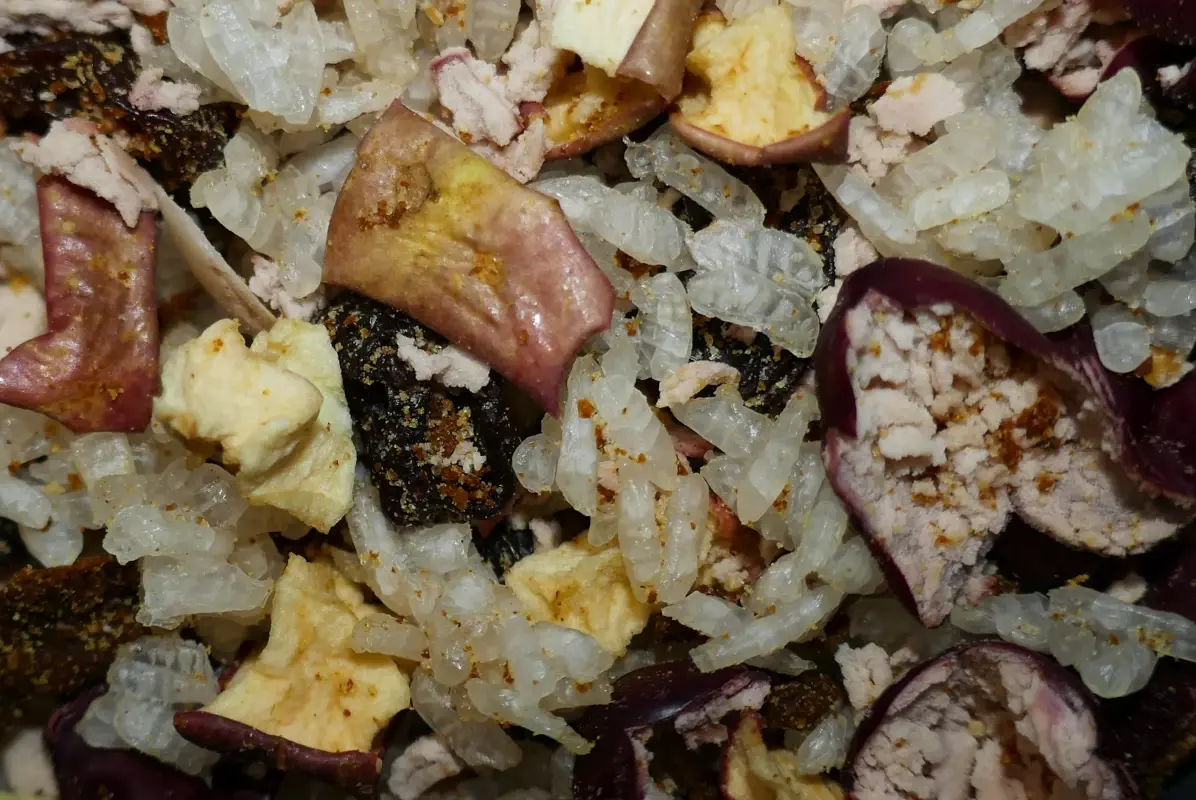 A mix of dehydrated rice, apple, kidney beans, and curry paste.