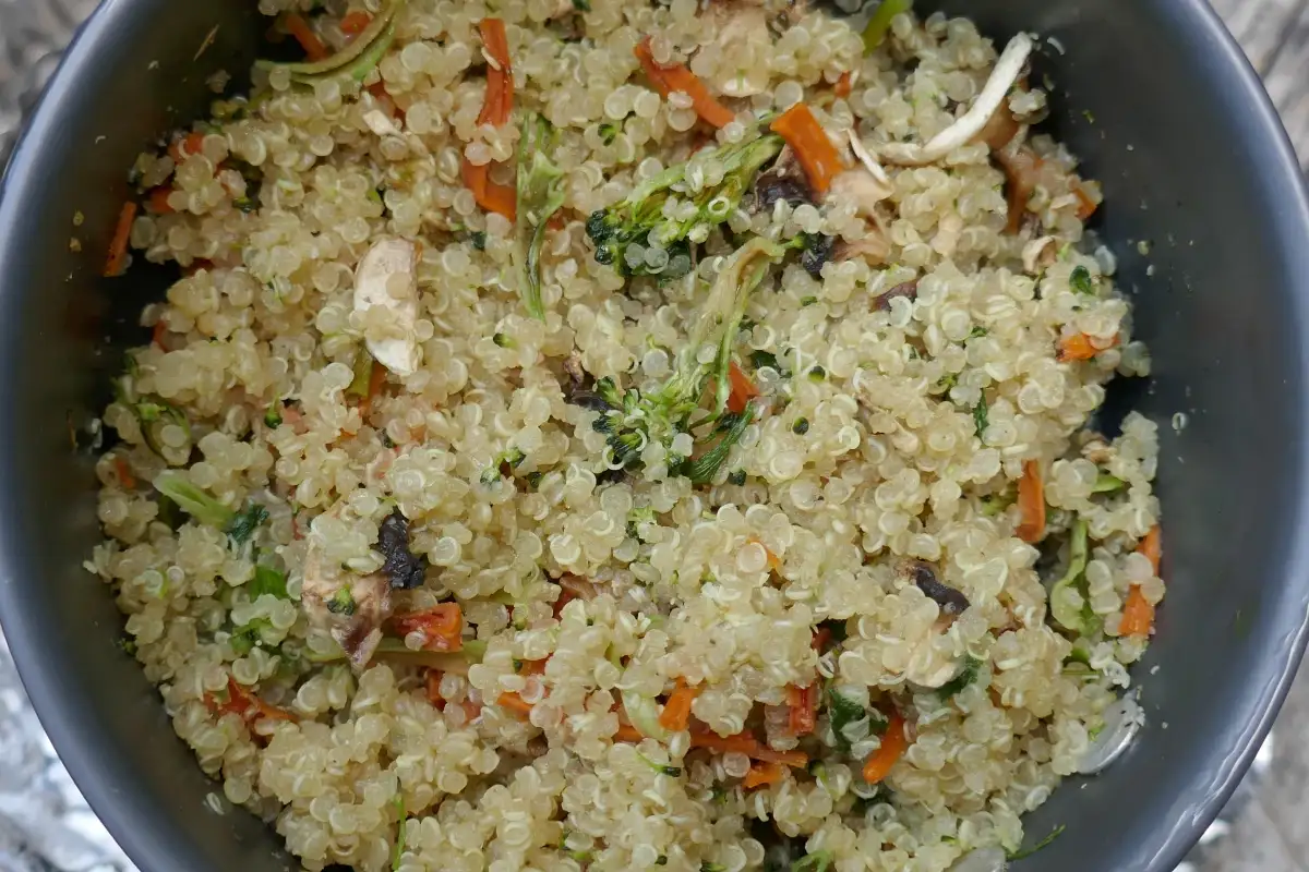 A quinoa and veggie medley sits in a pot.