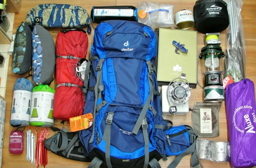 A set of backpacking gear is laid out on the floor.