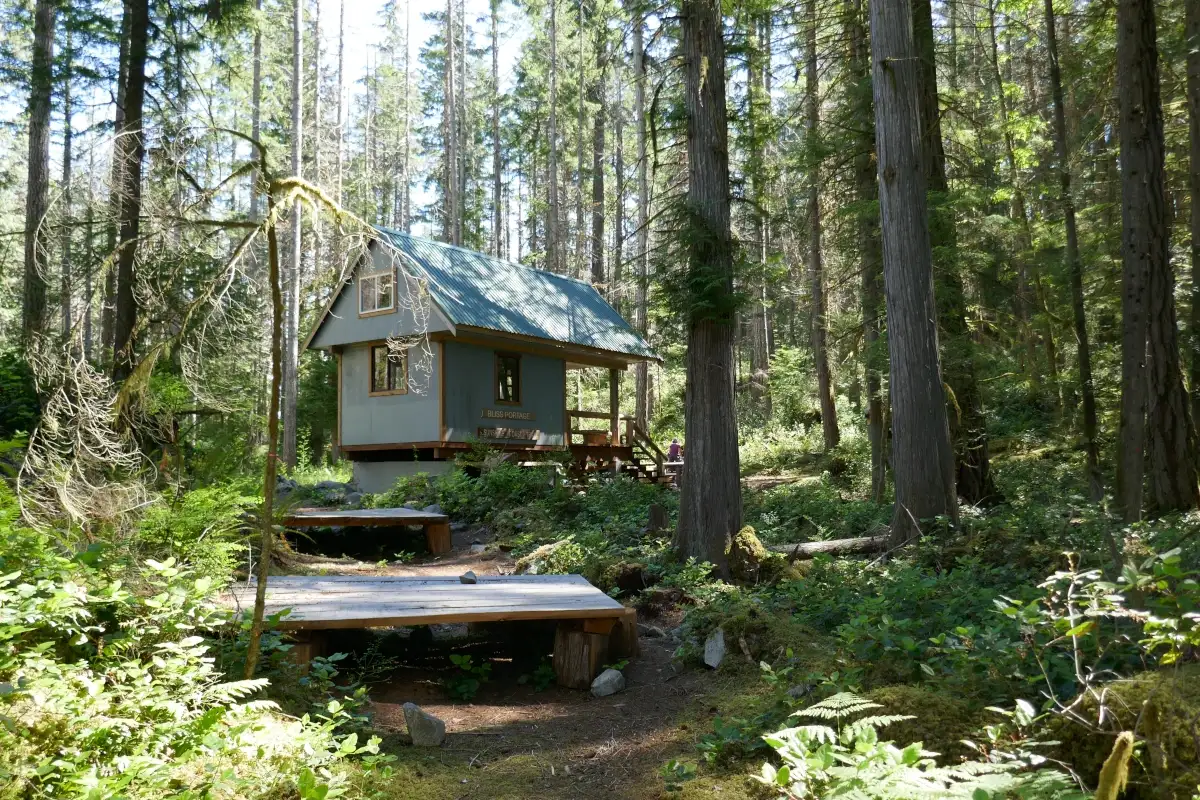 The Bliss Portage hut neatled in the woods on the Sunshine Coast Trail.
