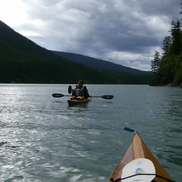 Two paddlers make their way on the Bowron Lake Circuit.
