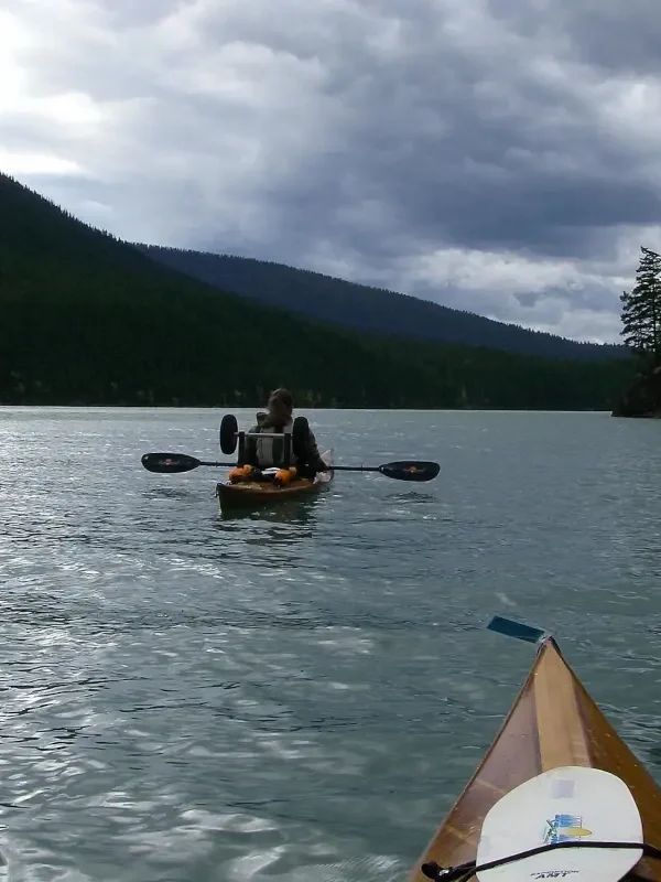 Two paddlers make their way on the Bowron Lake Circuit.