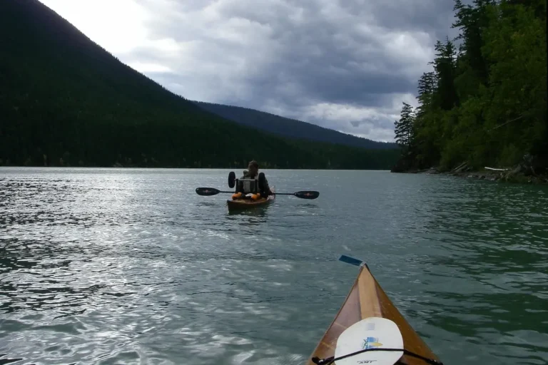 Two paddlers make their way on the Bowron Lake Circuit.