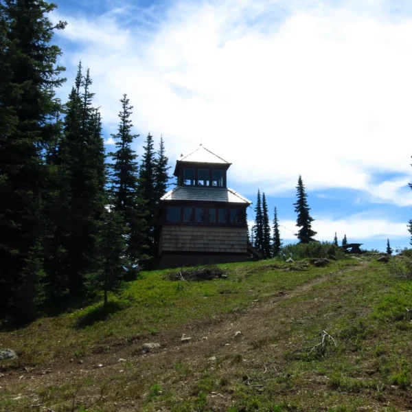 Windy Joe fire lookout perched on a hill in Manning Park, BC.