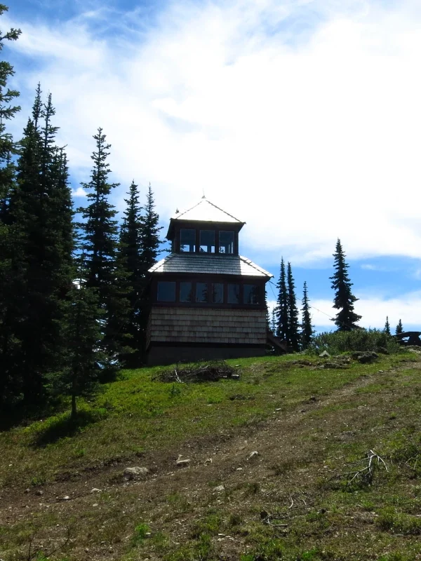 Windy Joe fire lookout perched on a hill in Manning Park, BC.