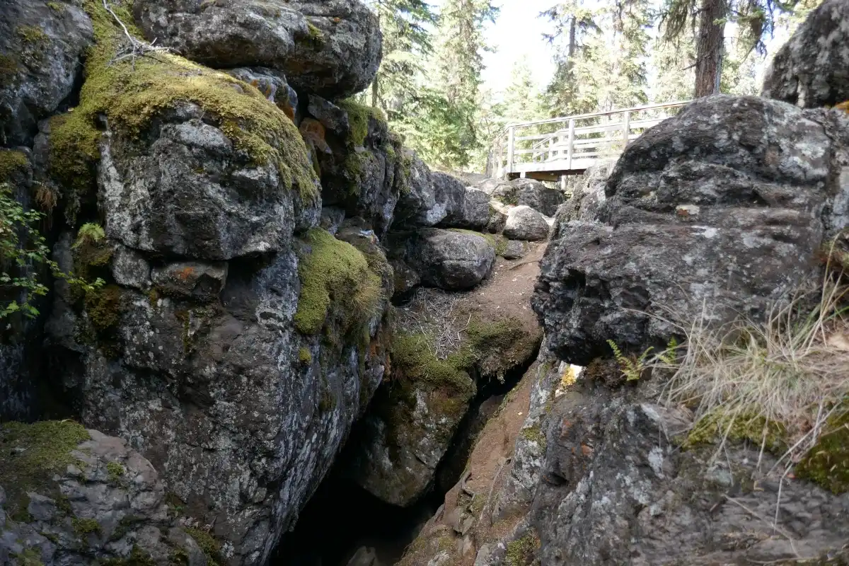 A cave is seen below a view platform at the Bridge Lake Ice Caves.